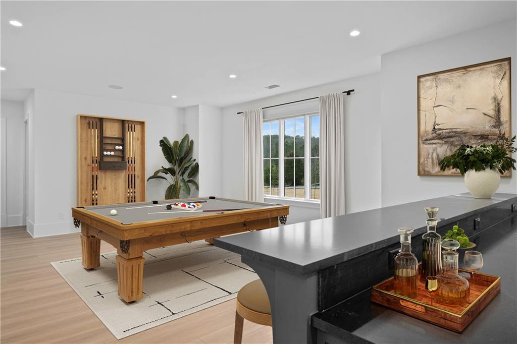 10210 Cedar Ridge Drive Milton, GA 30004 - Photo 38 of 47 a living room with furniture pool table and a potted plant