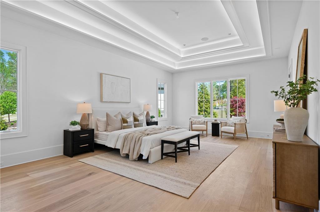 10210 Cedar Ridge Drive Milton, GA 30004 - Photo 6 of 47 a bedroom with furniture and a large window