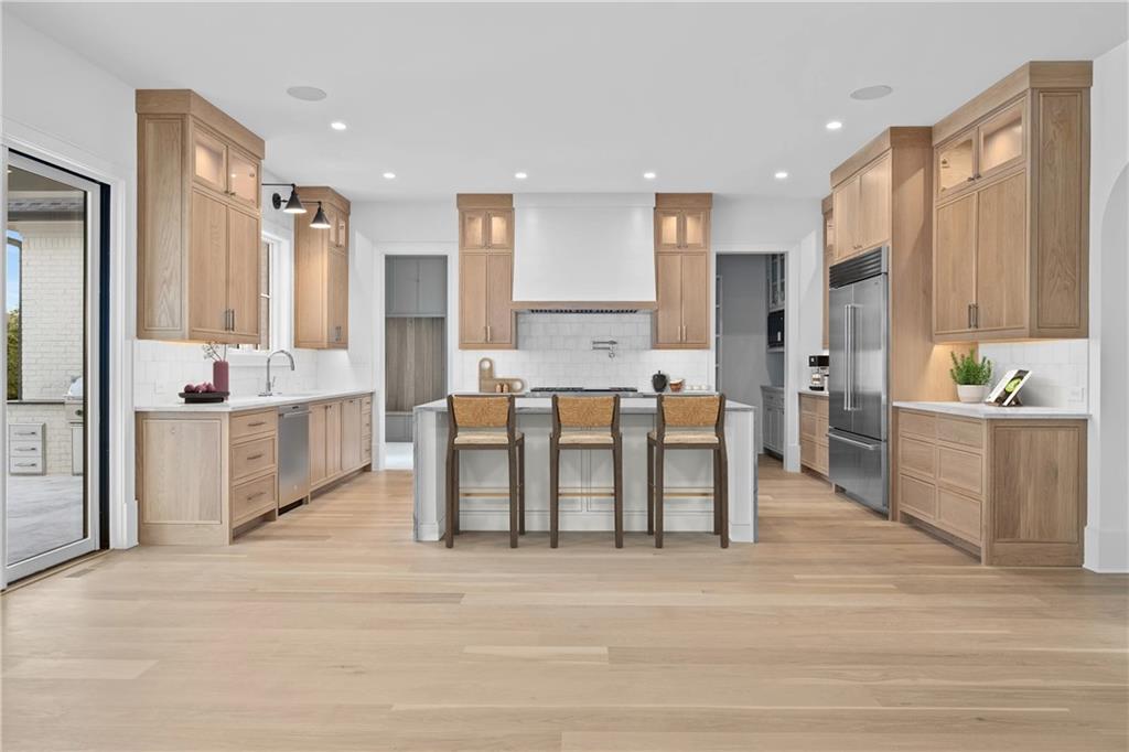 10210 Cedar Ridge Drive Milton, GA 30004 - Photo 7 of 24 a large kitchen with lots of counter space and a refrigerator