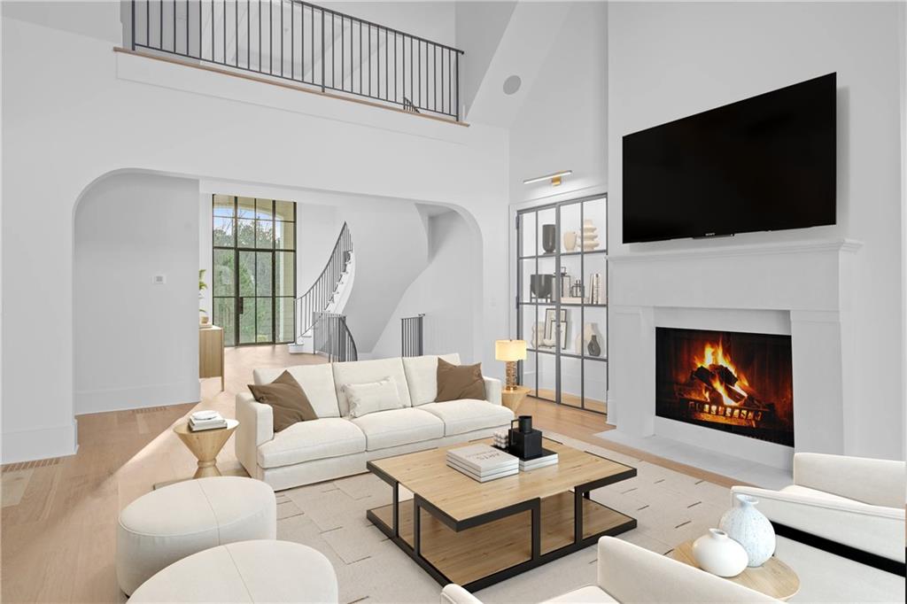 10210 Cedar Ridge Drive Milton, GA 30004 - Photo 10 of 24 a living room with fireplace furniture and a flat screen tv