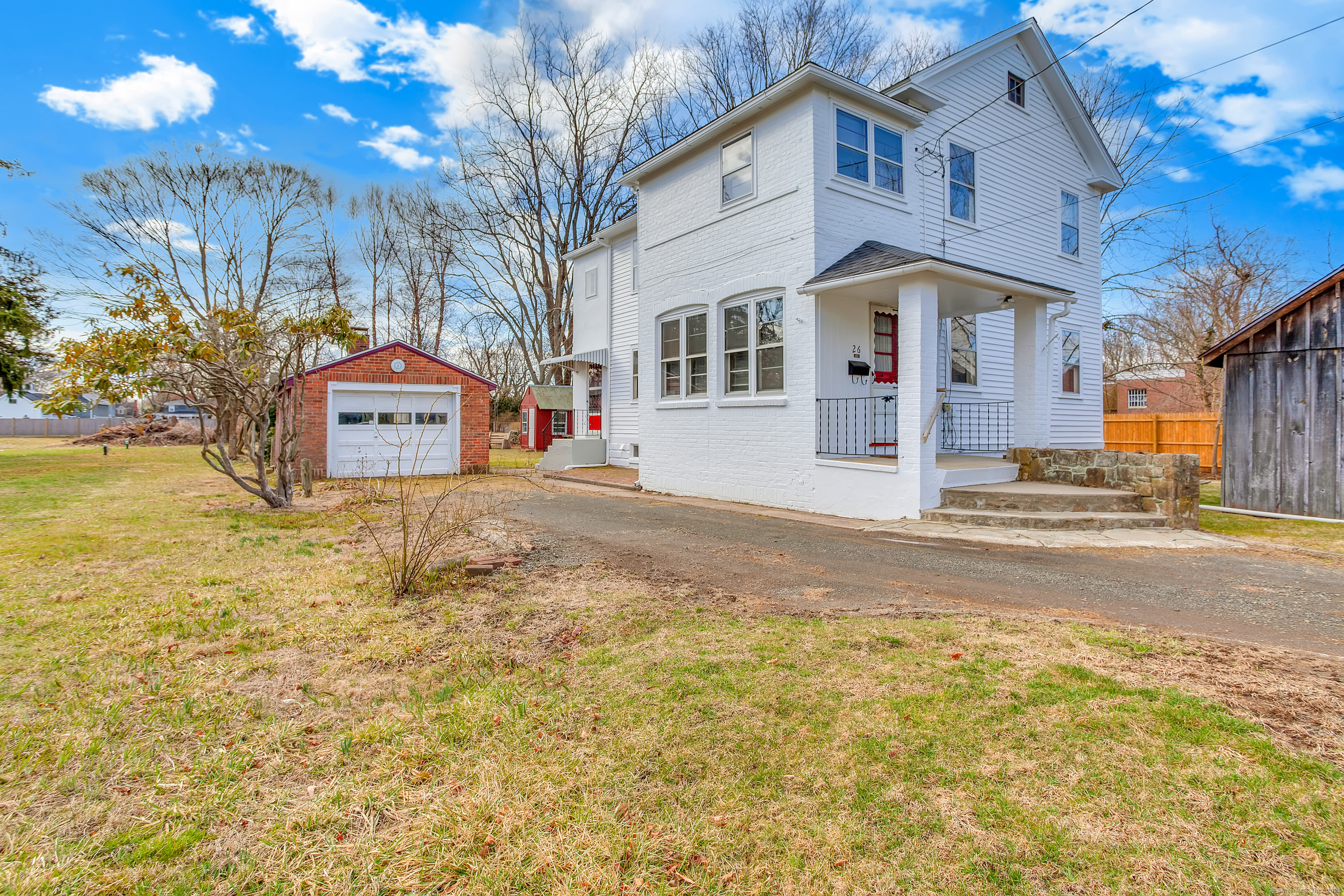 a front view of a house with a yard