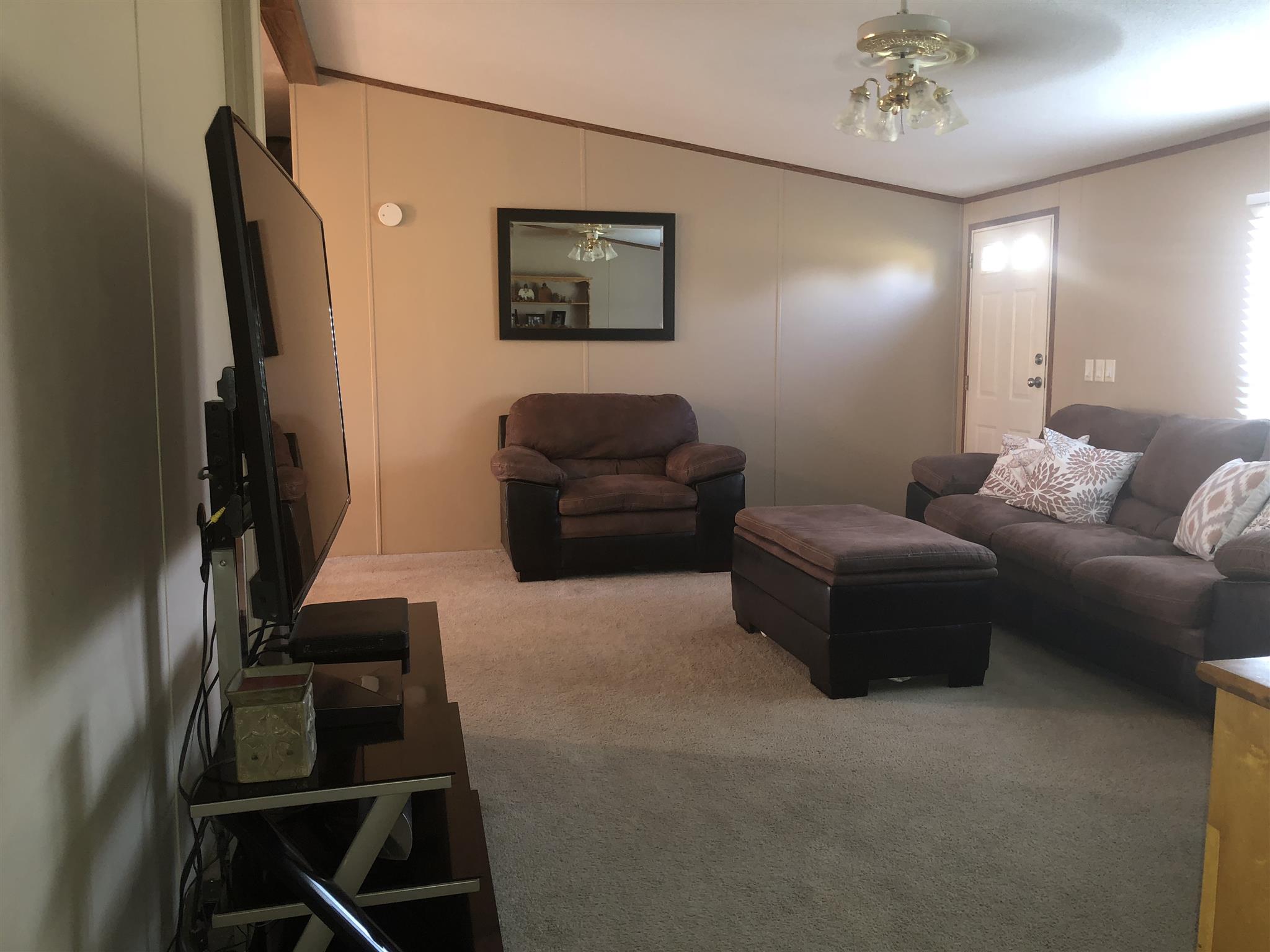 3692 Gwynn Road Lebanon, TN 37090 - Photo 4 of 10 a living room with furniture and a flat screen tv