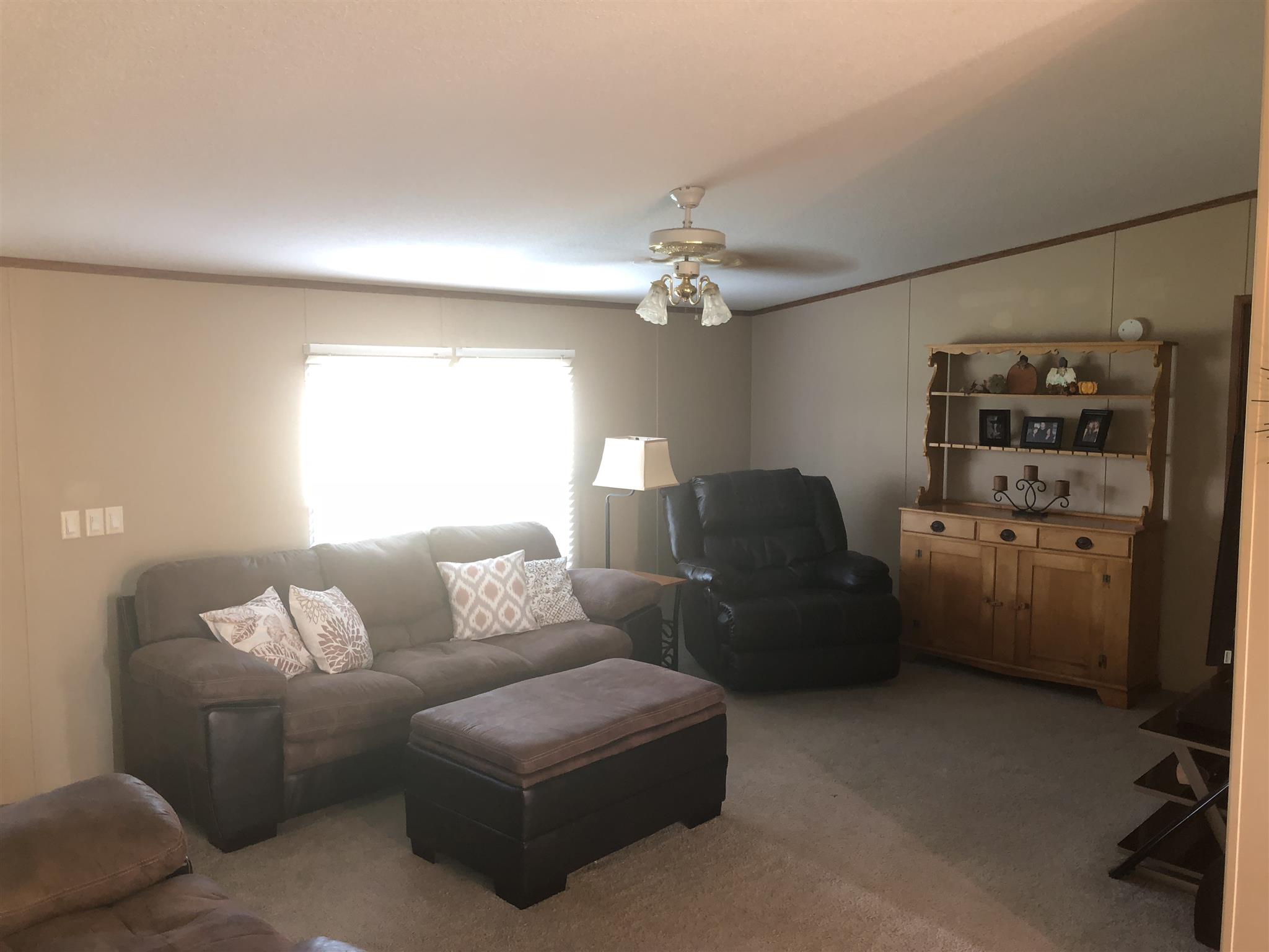 3692 Gwynn Road Lebanon, TN 37090 - Photo 5 of 10 a living room with furniture a chandelier and a window