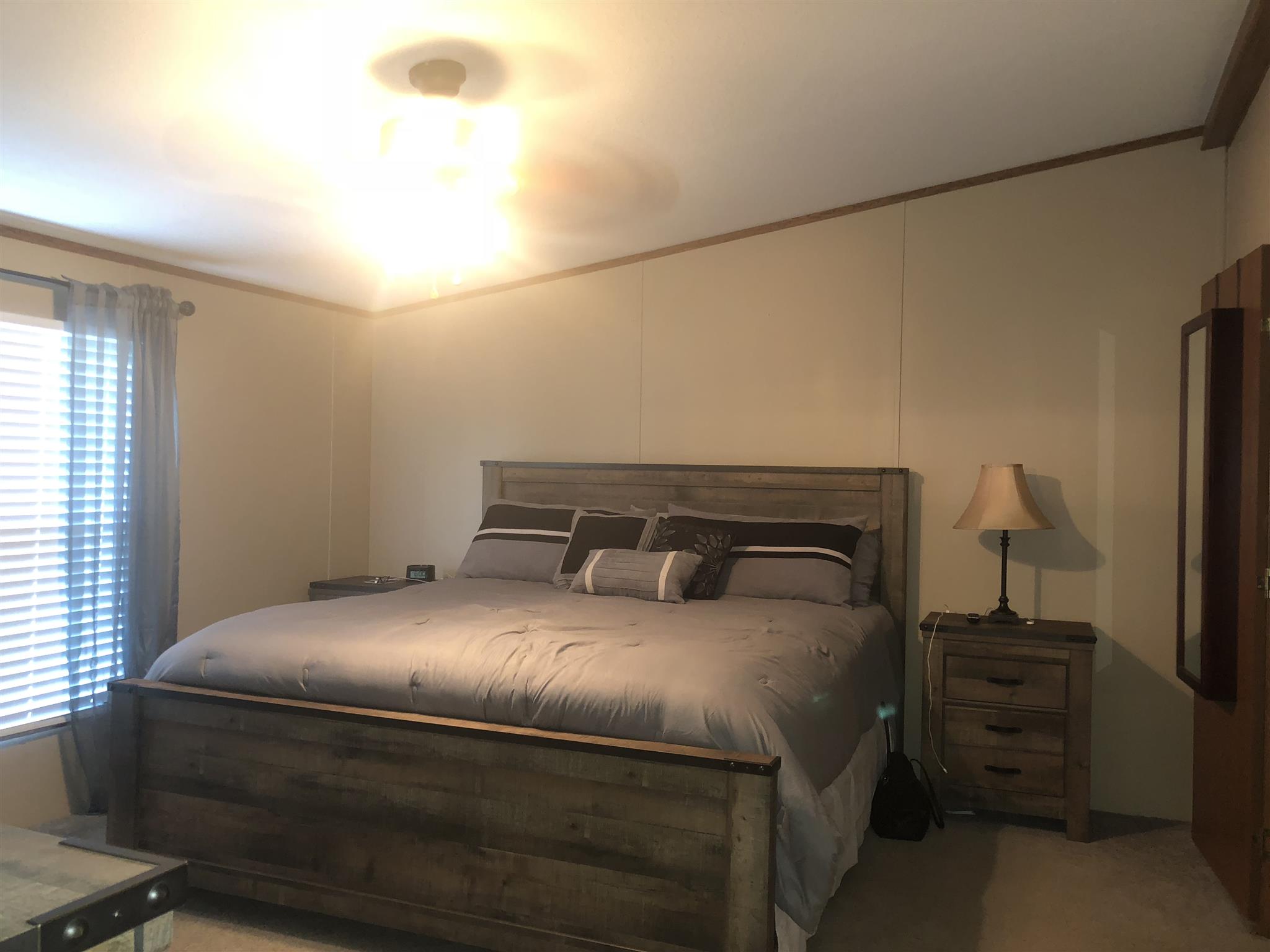 3692 Gwynn Road Lebanon, TN 37090 - Photo 6 of 10 a bedroom with a bed and a night stand