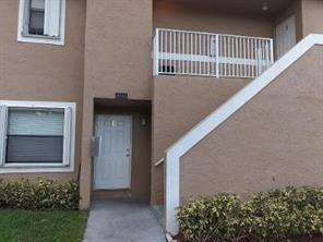 4100 Riverside Drive, Unit 1 Coral Springs, FL 33065 - Photo 1 of 22 a view of balcony with small garden