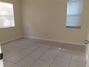 4100 Riverside Drive, Unit 1 Coral Springs, FL 33065 - Photo 11 of 22 an empty room with a window
