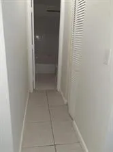 a bathroom with a toilet and a bathtub