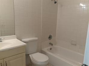 4100 Riverside Drive, Unit 1 Coral Springs, FL 33065 - Photo 15 of 22 a bathroom with a sink a toilet and bathtub