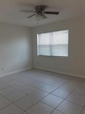 4100 Riverside Drive, Unit 1 Coral Springs, FL 33065 - Photo 16 of 22 an empty room with a window