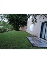 4100 Riverside Drive, Unit 1 Coral Springs, FL 33065 - Photo 21 of 22 a view of a back yard