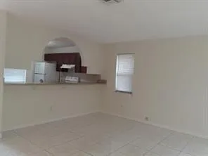 a kitchen with a sink cabinets and window