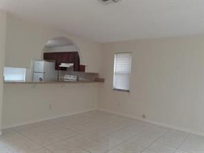 4100 Riverside Drive, Unit 1 Coral Springs, FL 33065 - Photo 4 of 22 a kitchen with a sink cabinets and window