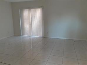 4100 Riverside Drive, Unit 1 Coral Springs, FL 33065 - Photo 6 of 22 a view of an empty room with a window