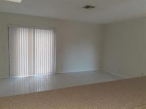 4100 Riverside Drive, Unit 1 Coral Springs, FL 33065 - Photo 10 of 22 an empty room with a window