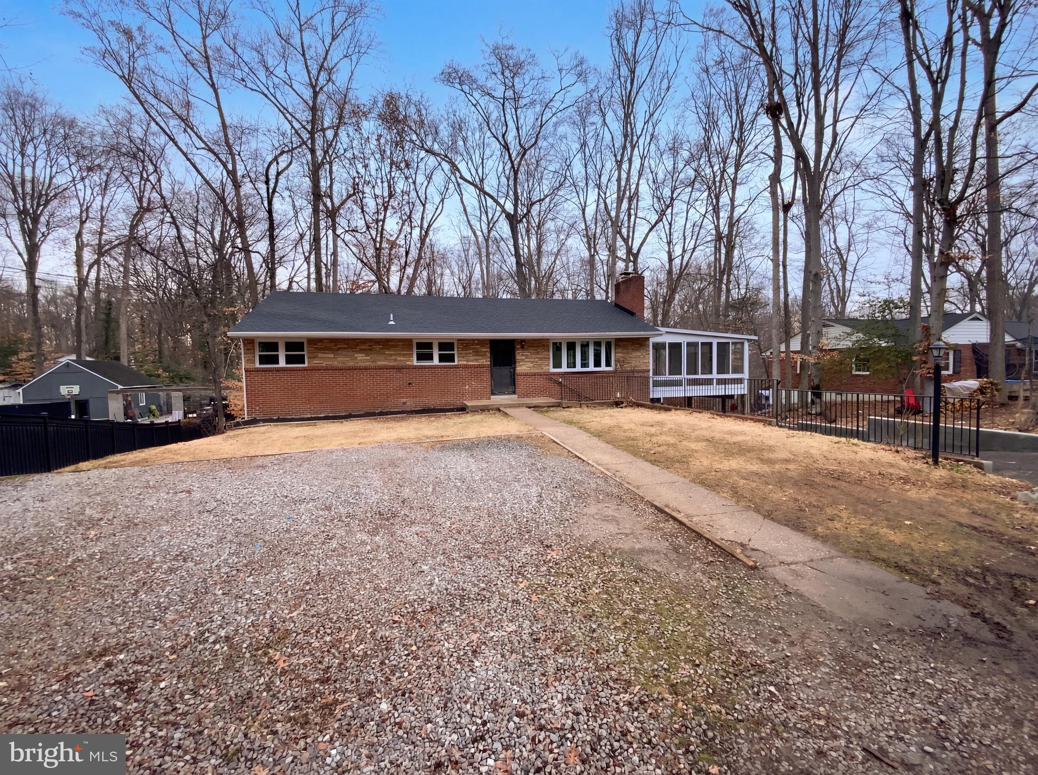18320 Candice Drive Triangle, VA 22172 - Photo 1 of 19 a view of swimming pool with outdoor seating and trees