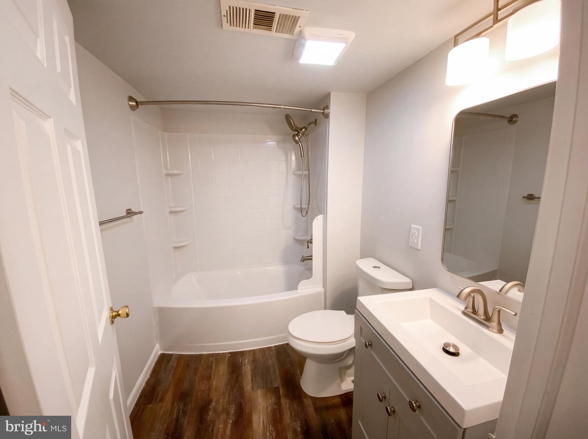 18320 Candice Drive Triangle, VA 22172 - Photo 17 of 19 a bathroom with a sink toilet and shower
