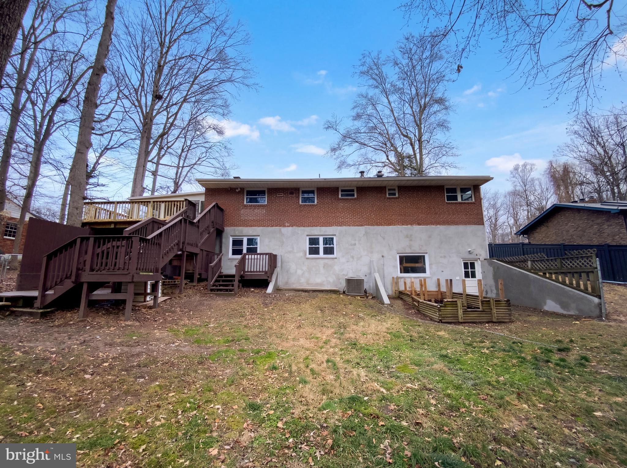18320 Candice Drive Triangle, VA 22172 - Photo 18 of 19 a view of a house with a yard and sitting area