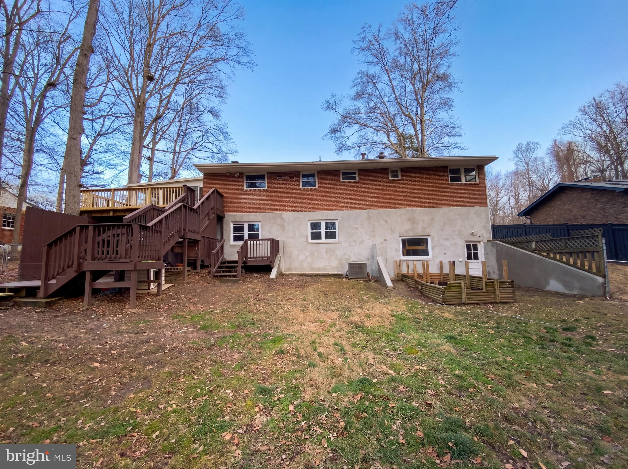 18320 Candice Drive Triangle, VA 22172 - Photo 5 of 19 a view of a house with a big yard and large tree