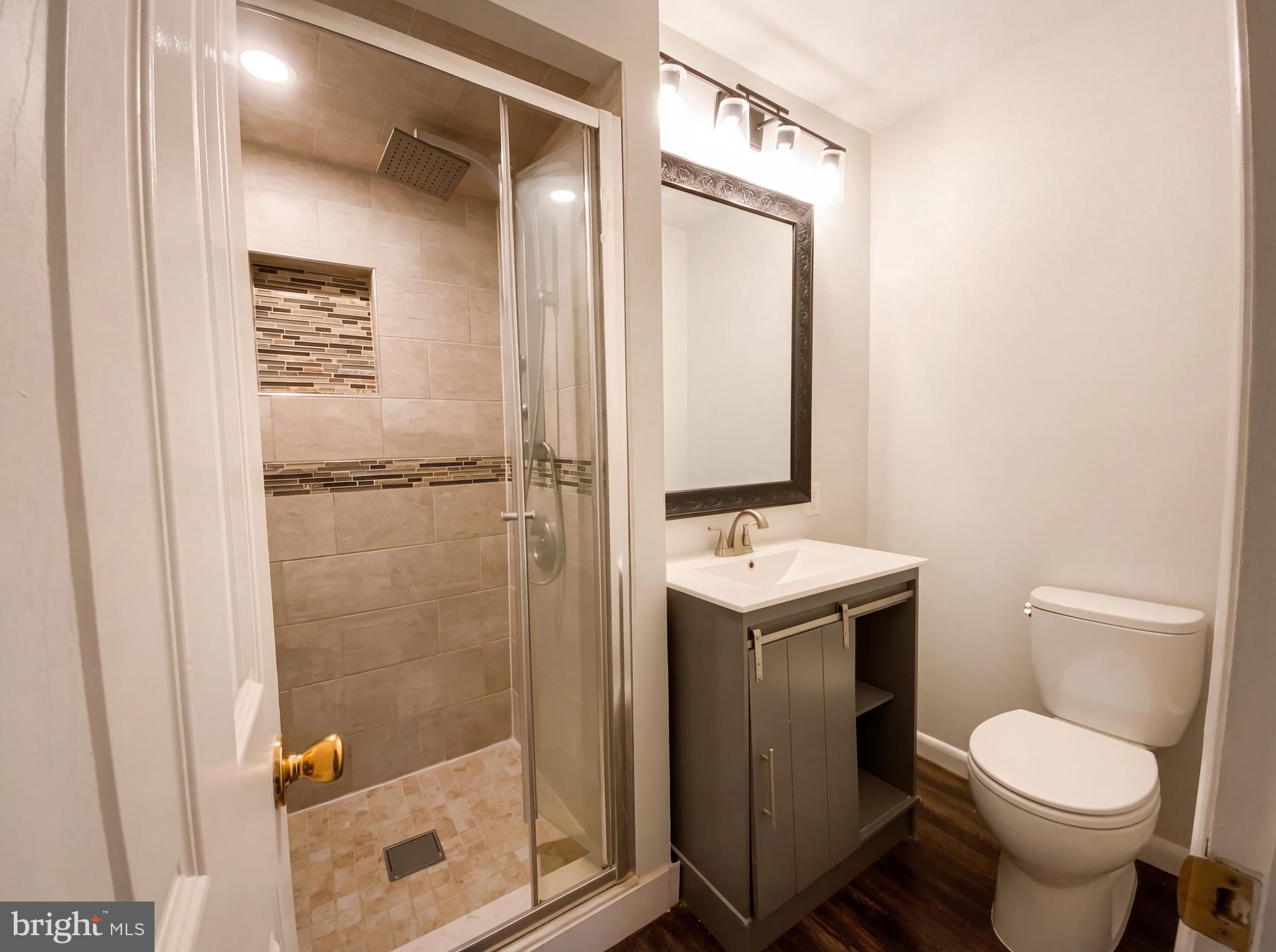 18320 Candice Drive Triangle, VA 22172 - Photo 10 of 19 a bathroom with a toilet a sink and shower