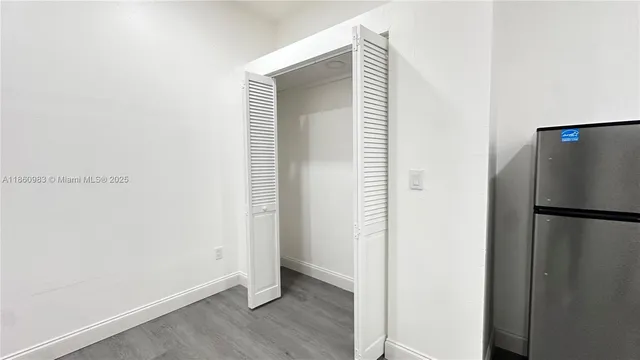 a view of a kitchen with a refrigerator