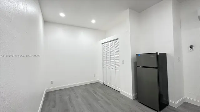 an empty room with wooden floor