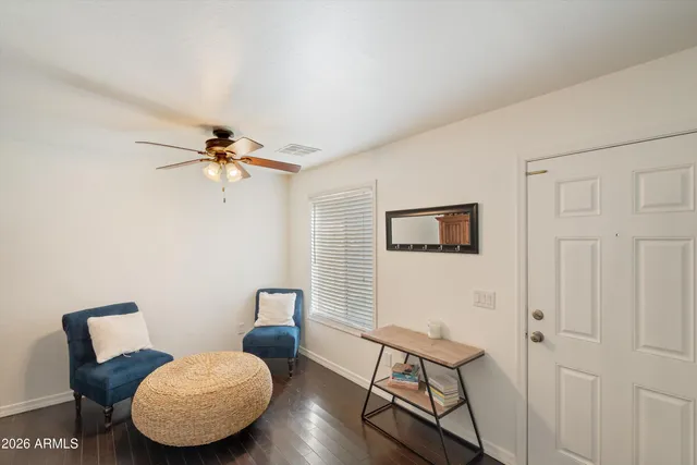 a bedroom with furniture and wooden floor