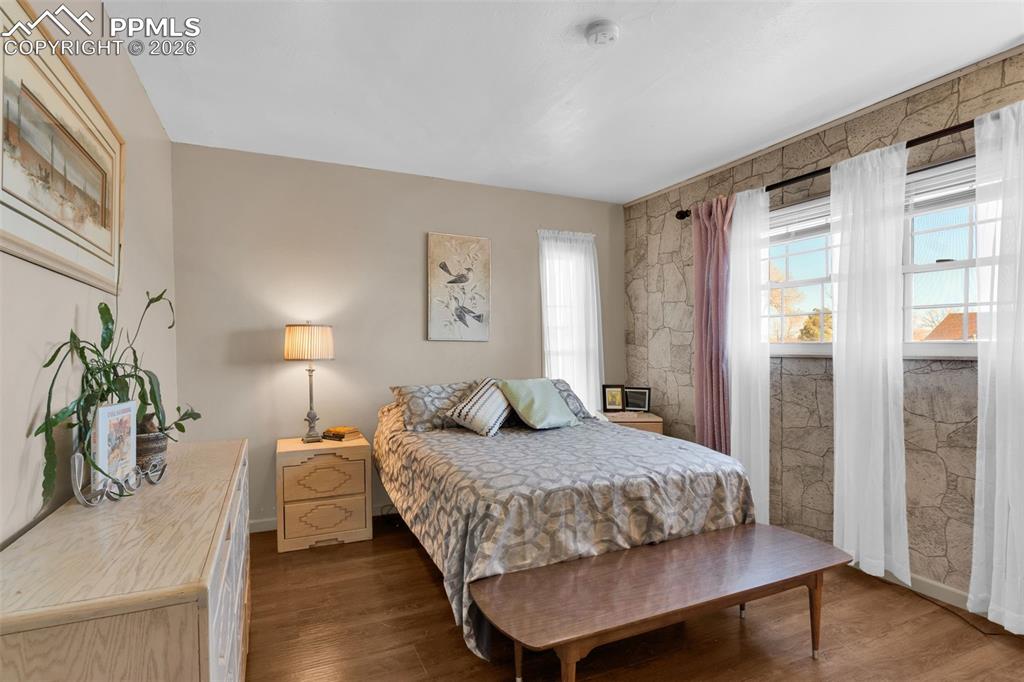 5796 County Rd CC108 Colorado City, CO 81019 - Photo 27 of 48 a bedroom with a large bed and a potted plant