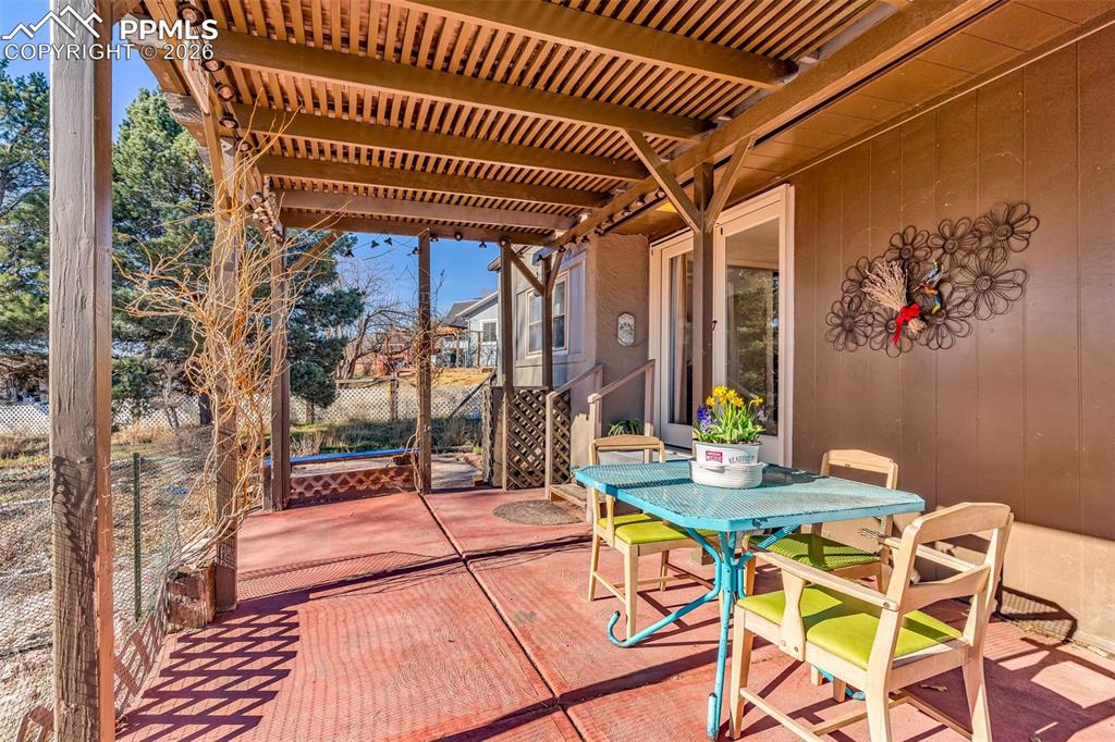 5796 County Rd CC108 Colorado City, CO 81019 - Photo 31 of 48 a patio with glass top table and chairs