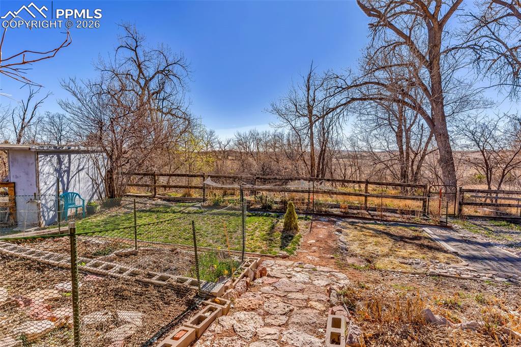 5796 County Rd CC108 Colorado City, CO 81019 - Photo 37 of 48 a view of a yard with wooden fence