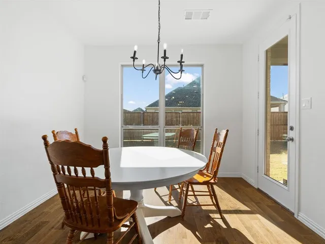 a bedroom with a large bed and a flat screen tv