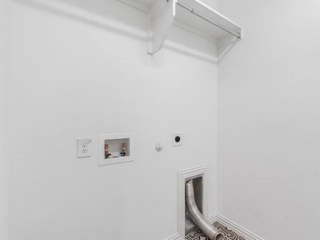 a view of a brick house with large windows