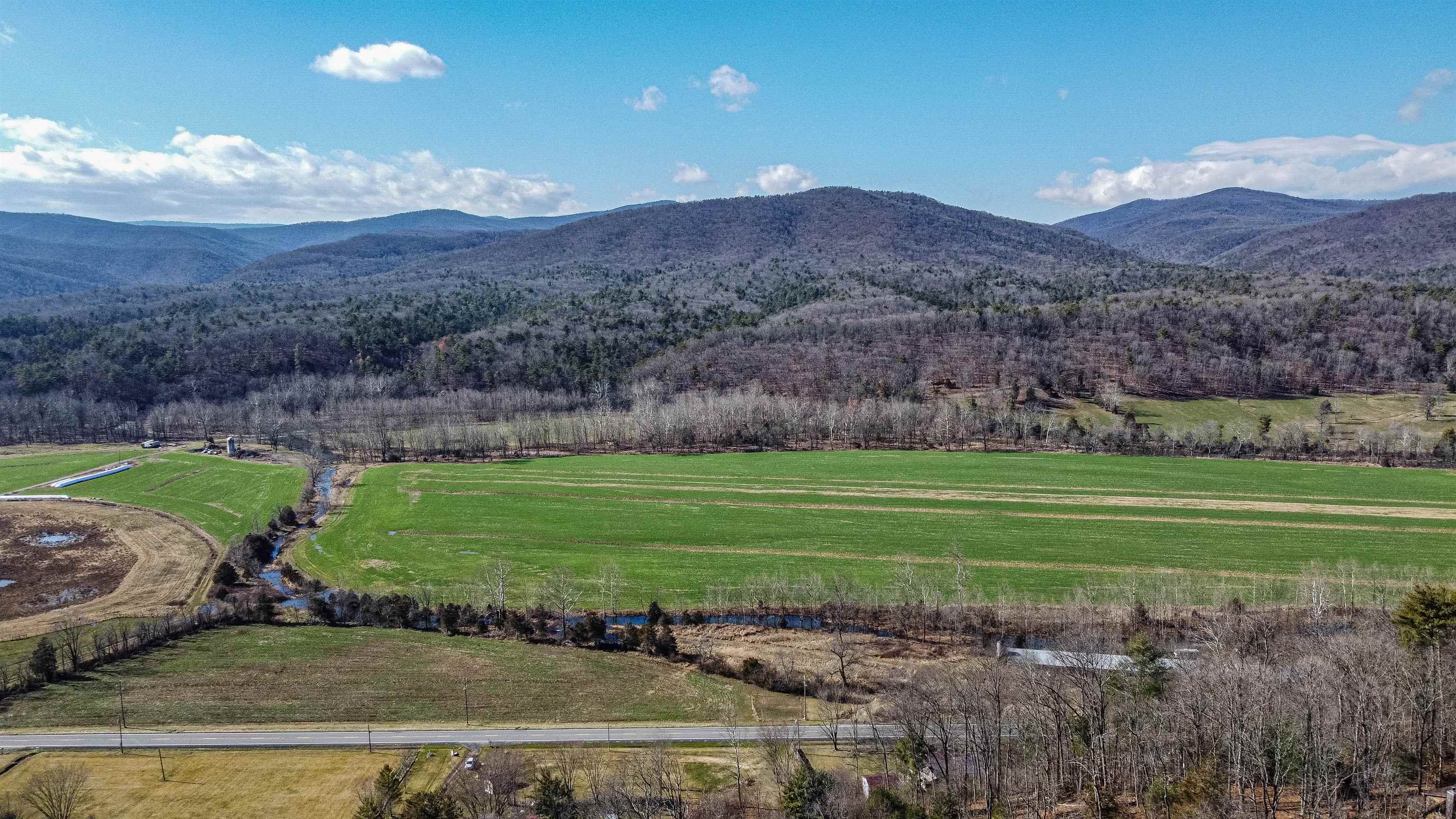 Tbd Rocky Ridge Lane Fulks Run, VA 22830 - Photo 10 of 10 a view of a grassy field with mountains in the background