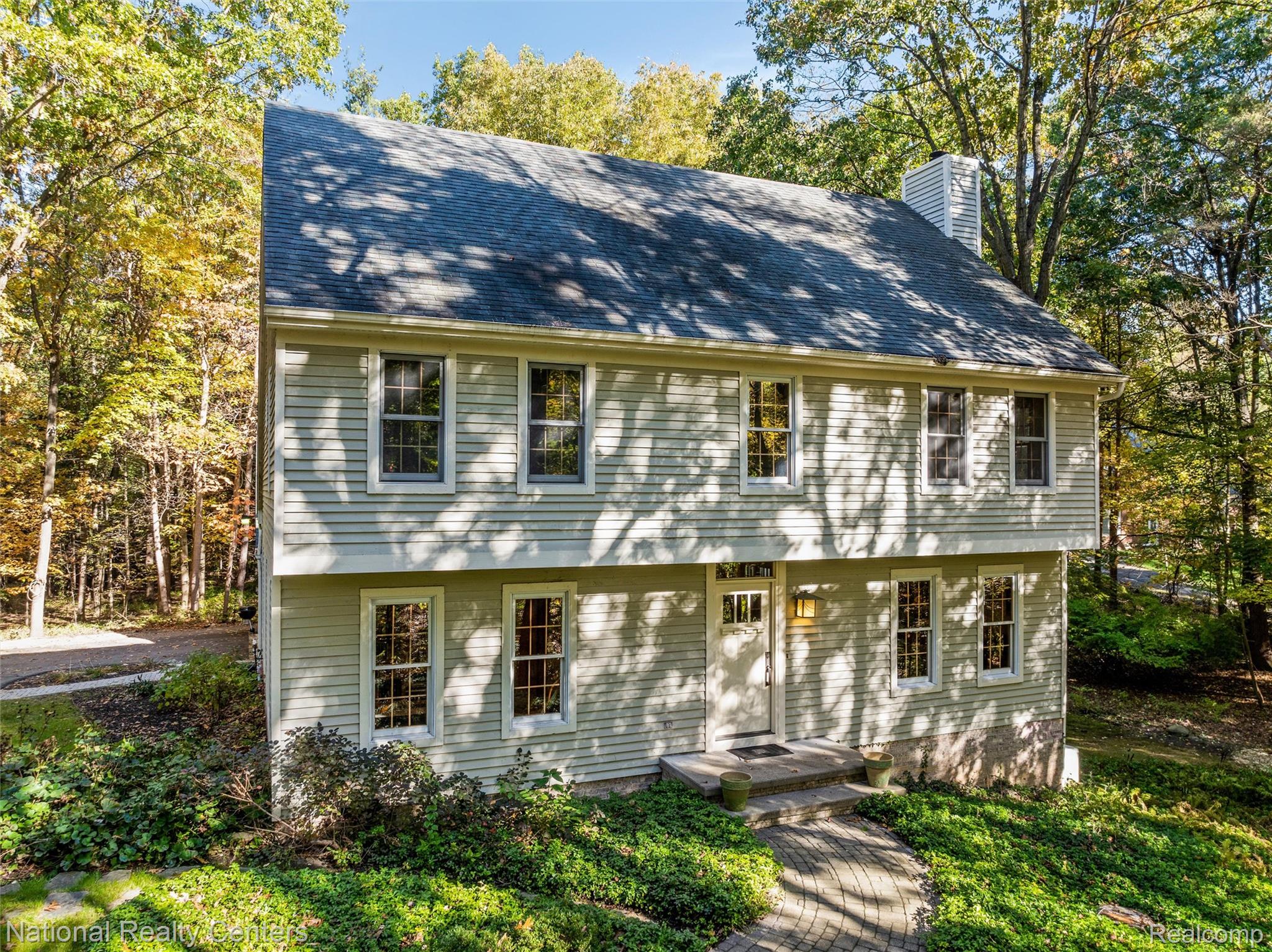 2322 Addaleen Road Highland, MI 48357 - Photo 2 of 54 Colonial house featuring a chimney