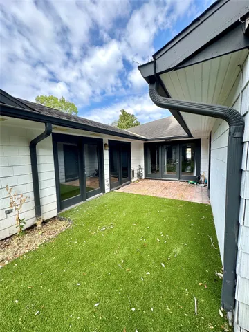 a view of a house with a garden
