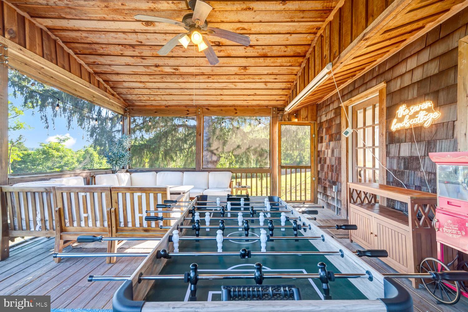 6235 South Page Valley Road Luray, VA 22835 - Photo 25 of 52 Charming porch with game table fun.