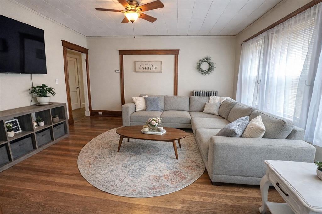 17 Bentley Street, Unit 1 Boston, MA 02135 - Photo 1 of 15 a living room with furniture and a flat screen tv