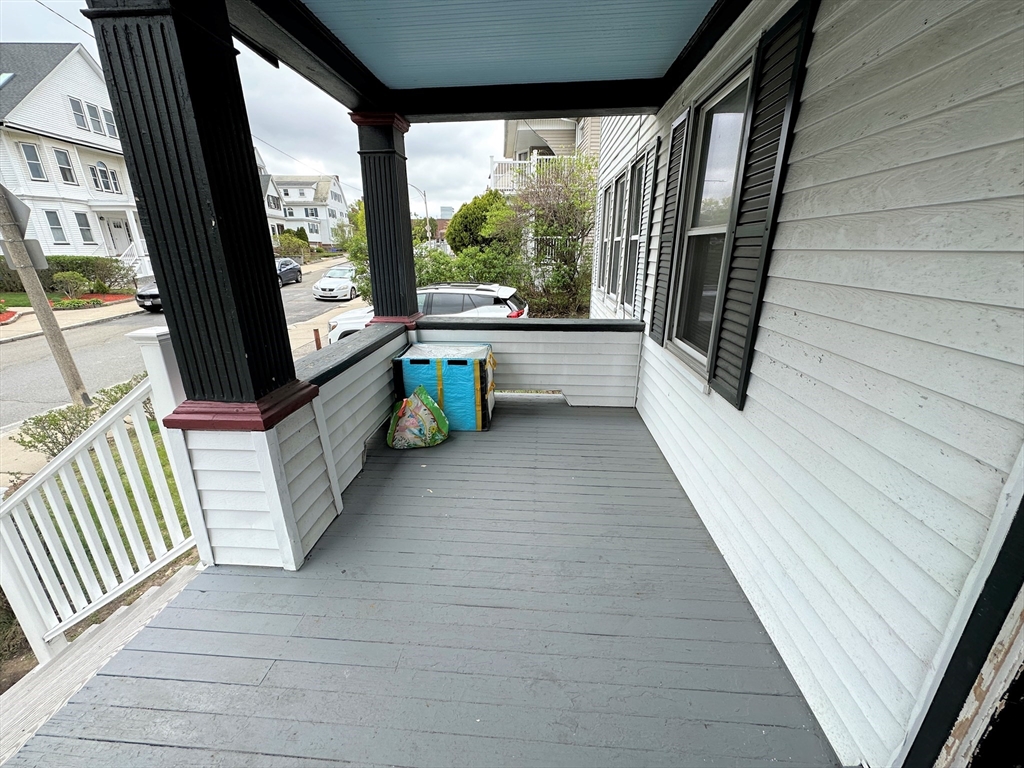 17 Bentley Street, Unit 1 Boston, MA 02135 - Photo 13 of 15 a view of a porch with wooden floor and furniture