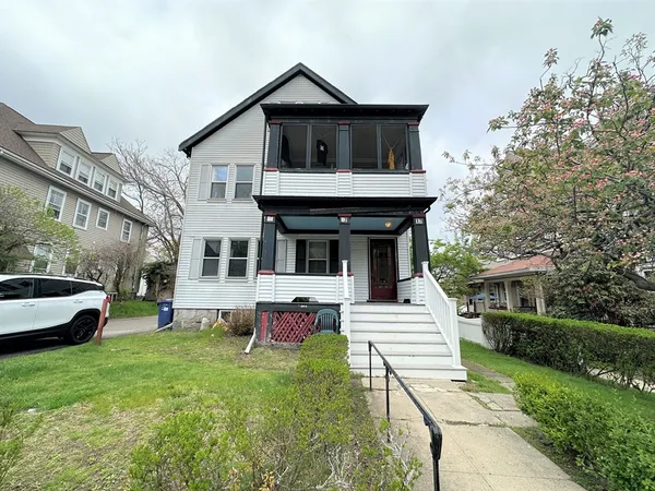 a view of a house with a yard