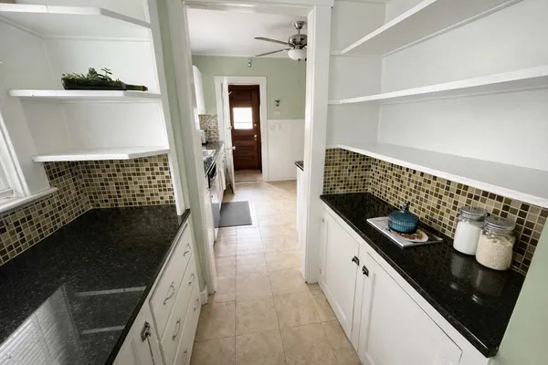 a kitchen with a sink and cabinets