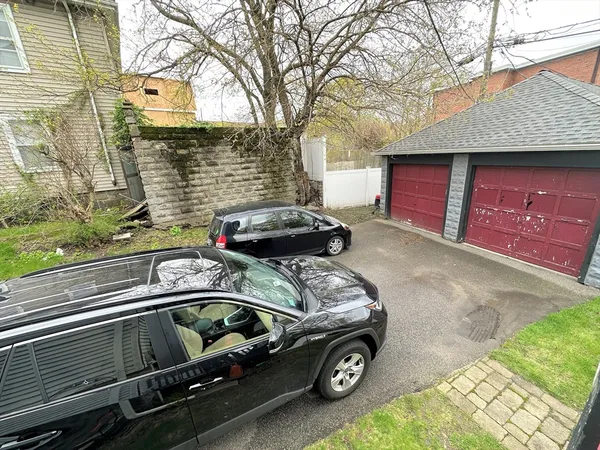 a view of a car parked front of a house