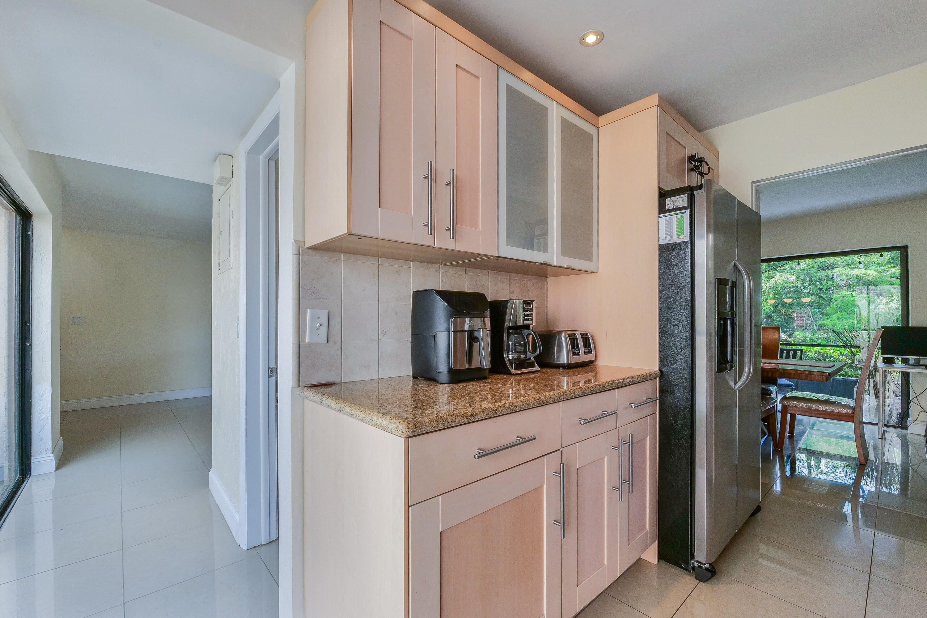 5523 Constant Spring Terrace, Unit 222 Lauderhill, FL 33319 - Photo 13 of 60 a kitchen with stainless steel appliances granite countertop a refrigerator and a sink