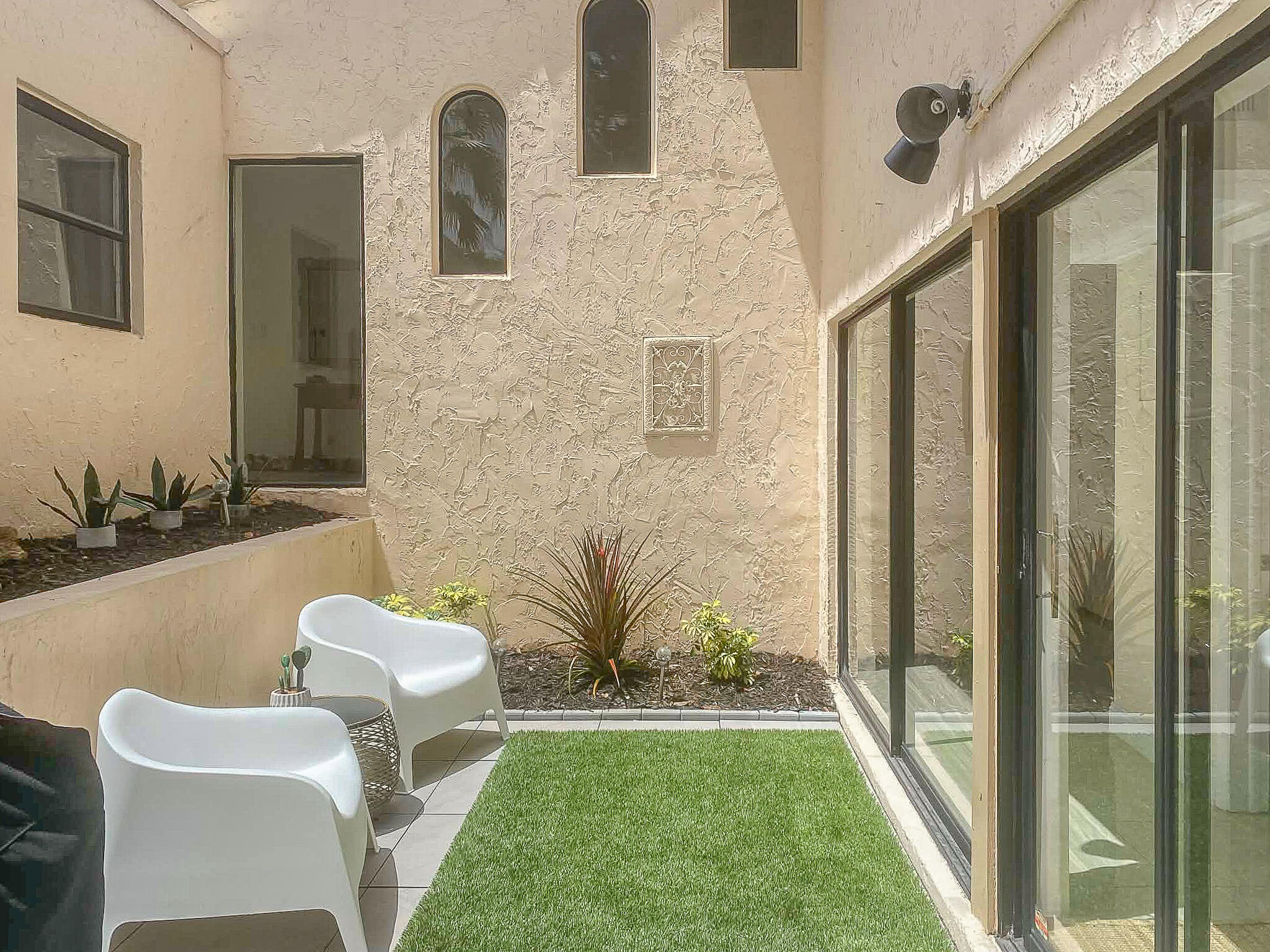 5523 Constant Spring Terrace, Unit 222 Lauderhill, FL 33319 - Photo 16 of 60 a front view of a house with outdoor seating