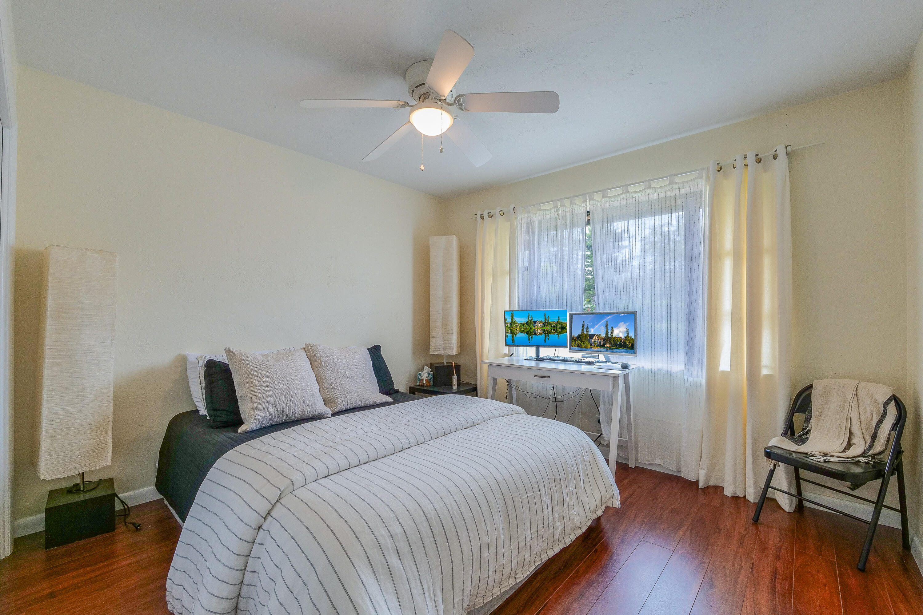 5523 Constant Spring Terrace, Unit 222 Lauderhill, FL 33319 - Photo 21 of 60 a bedroom with a bed and a chair