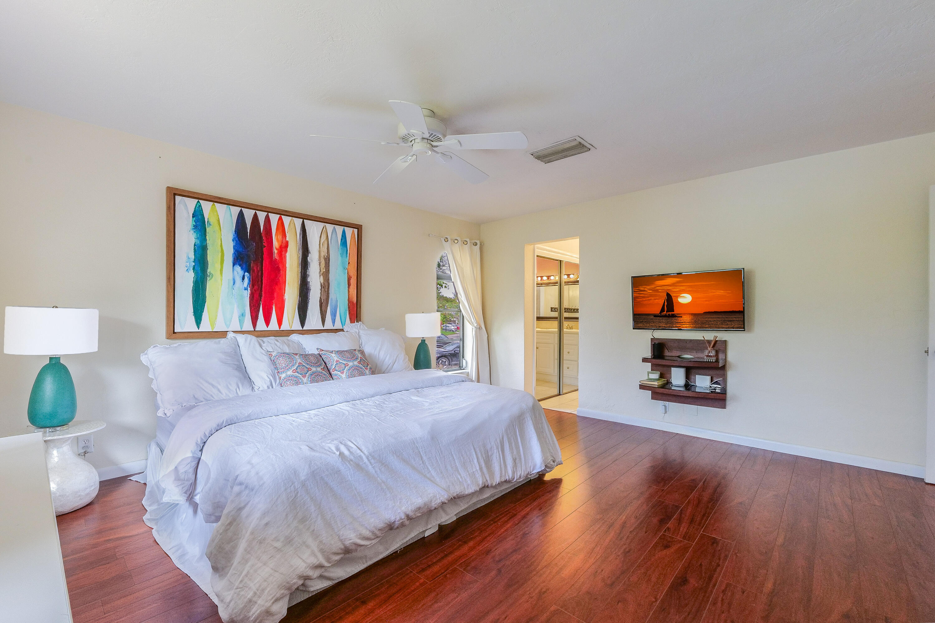 5523 Constant Spring Terrace, Unit 222 Lauderhill, FL 33319 - Photo 25 of 60 a bedroom with a bed and a flat screen tv