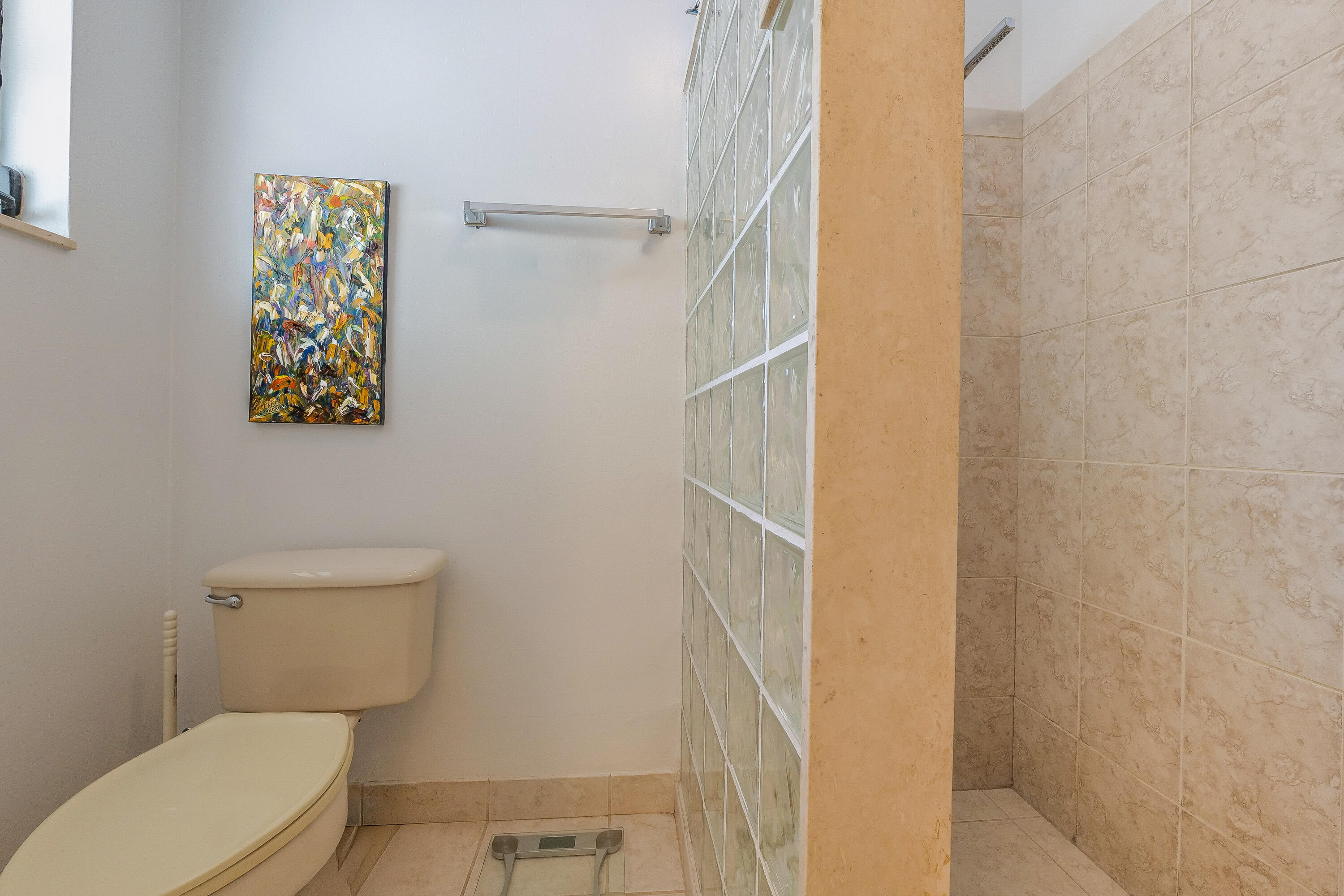 5523 Constant Spring Terrace, Unit 222 Lauderhill, FL 33319 - Photo 29 of 60 a white toilet sitting next to a shower curtain