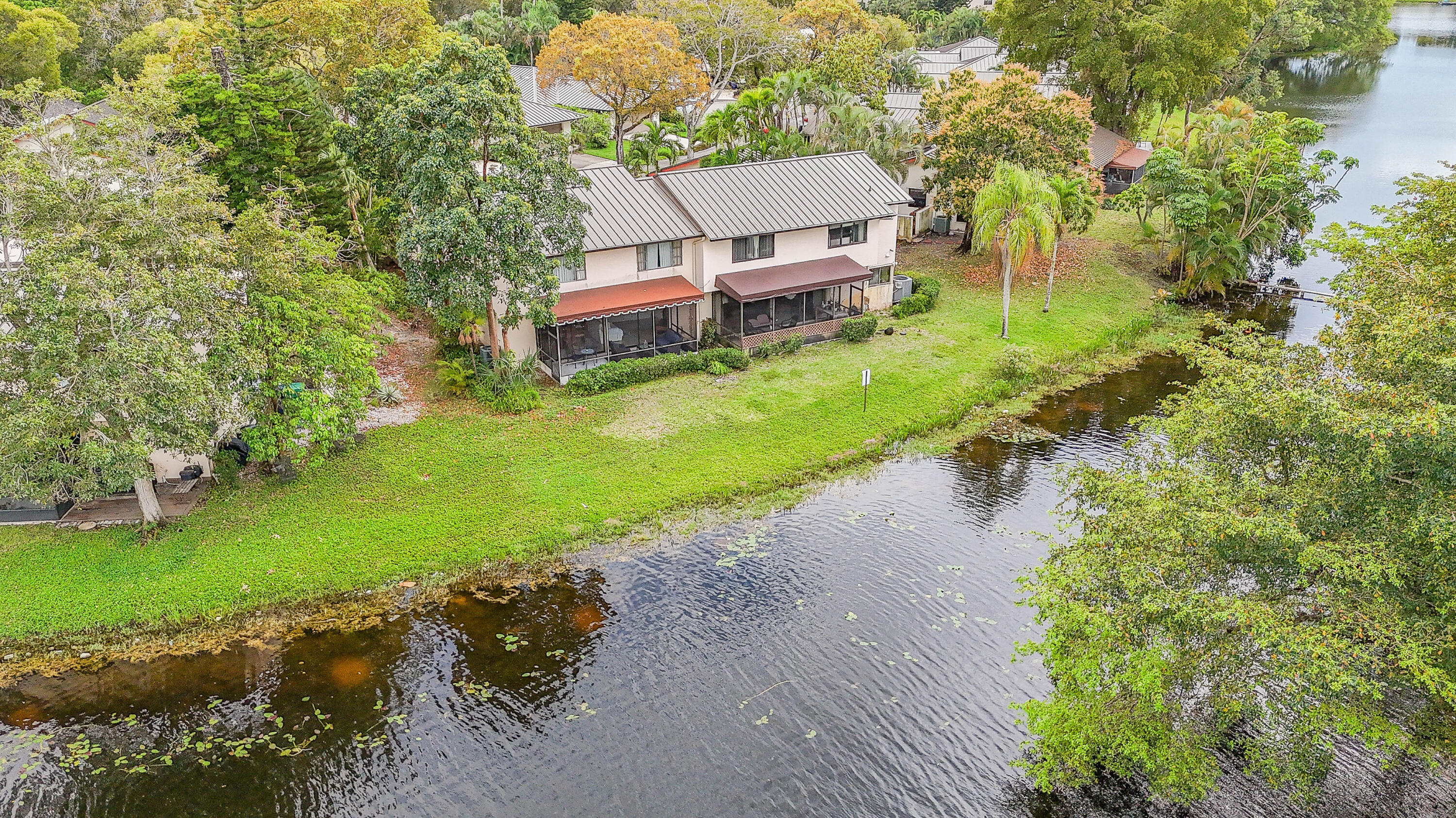 5523 Constant Spring Terrace, Unit 222 Lauderhill, FL 33319 - Photo 58 of 60 a aerial view of a house with a yard and lake view