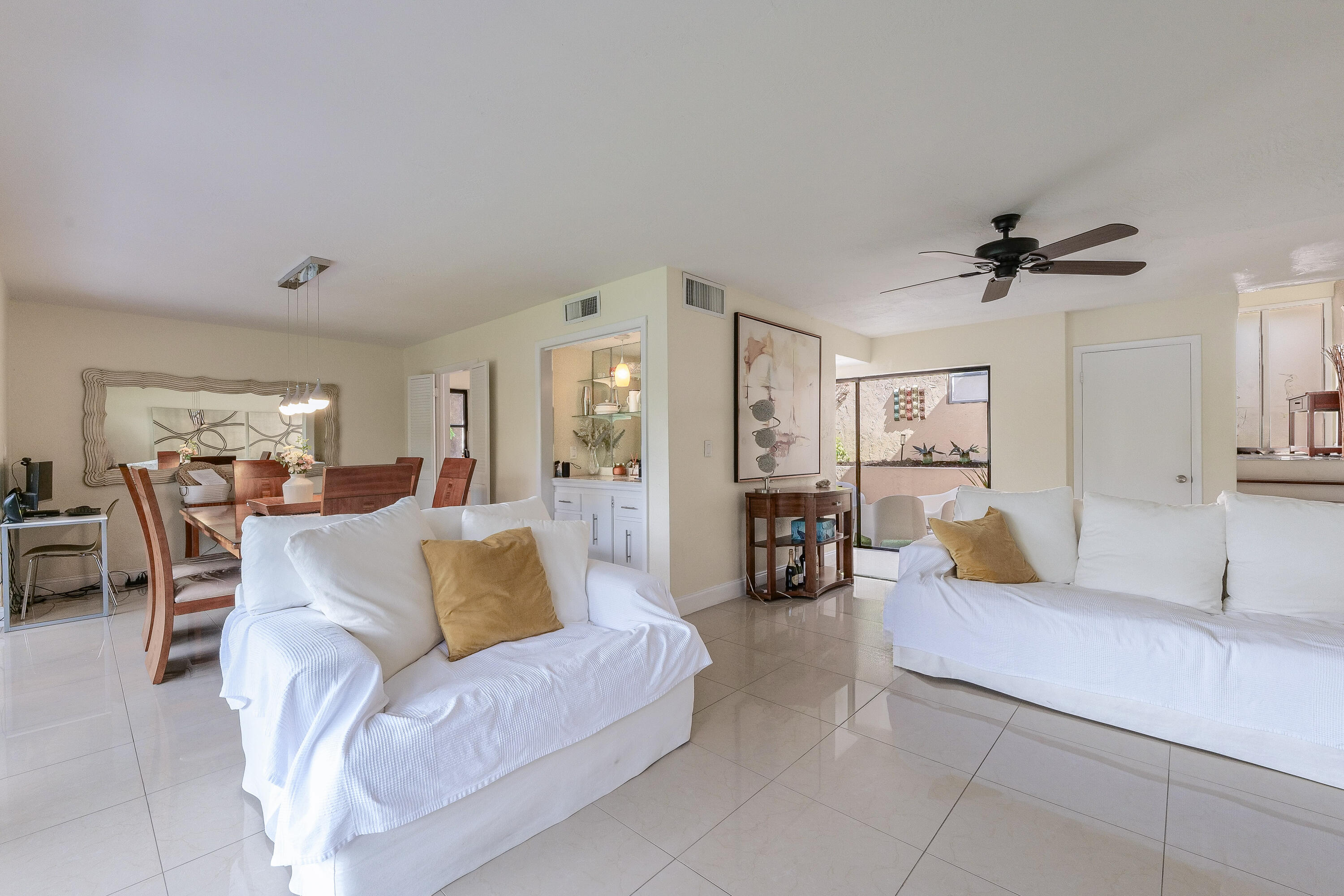 5523 Constant Spring Terrace, Unit 222 Lauderhill, FL 33319 - Photo 8 of 60 a living room with furniture and a ceiling fan