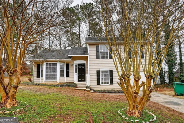 a front view of a house with yard