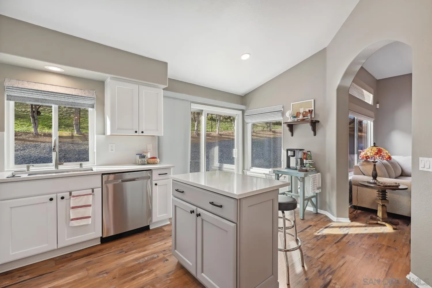 1783 Palomares Road Fallbrook, CA 92028 - Photo 11 of 40 a kitchen with a sink cabinets and dining table chair
