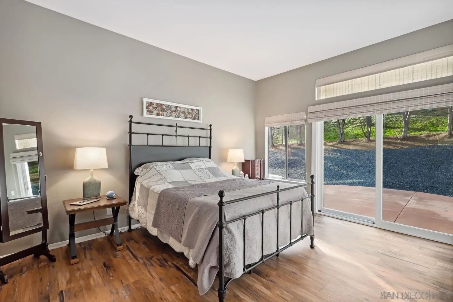 1783 Palomares Road Fallbrook, CA 92028 - Photo 15 of 40 a bed sitting in a bedroom next to a window